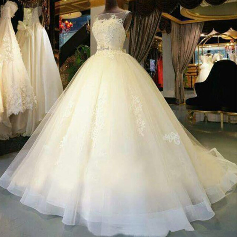 2019 Beautiful A-Line Sleeveless Tulle Wedding Dresses Illusion Neckline Appliques Elegnat Bridal Gowns Custom Made Court Train